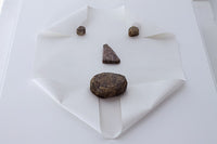 Untitled (rocks and paper) by Michael Dumontier